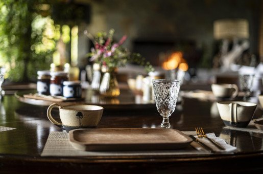 DINING ROOM - Morning ambiance. Soft light, a crackling fire, and a thoughtfully set table